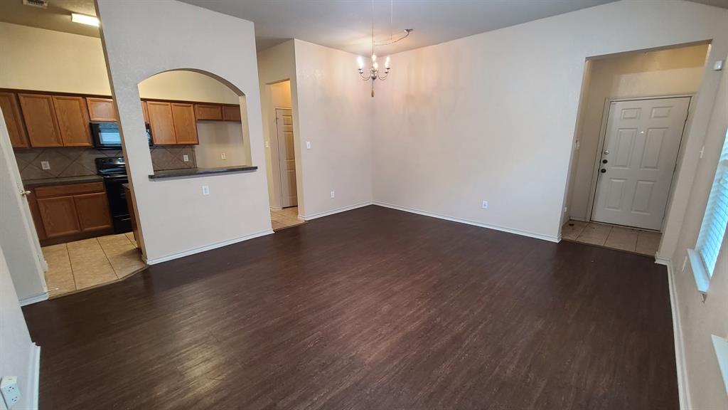 806 Walnut Street Burleson, TX 76028 - Photo 10 of 19 a view of a kitchen cabinets and wooden floor