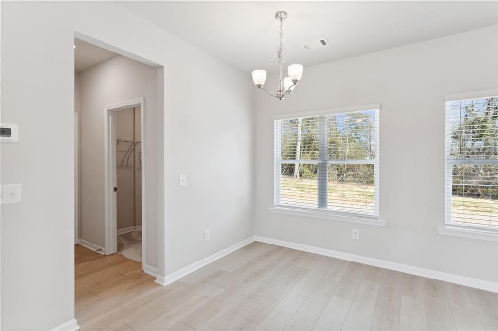 79 Water Oak Way Crawford, GA 30630 - Photo 14 of 51 a view of an empty room with a window