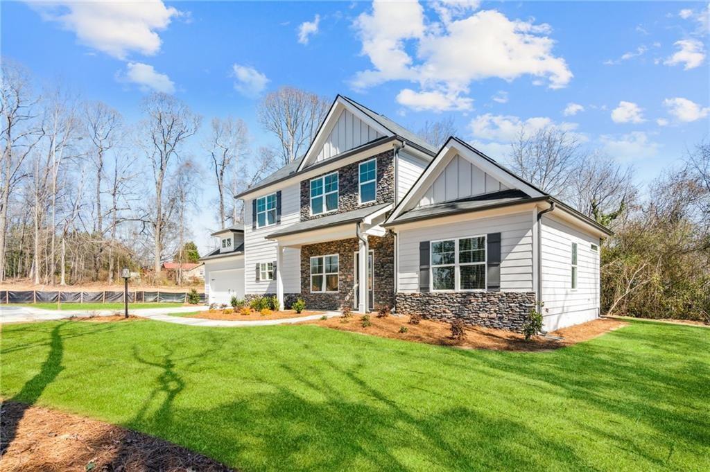 79 Water Oak Way Crawford, GA 30630 - Photo 2 of 51 a front view of house with yard and green space