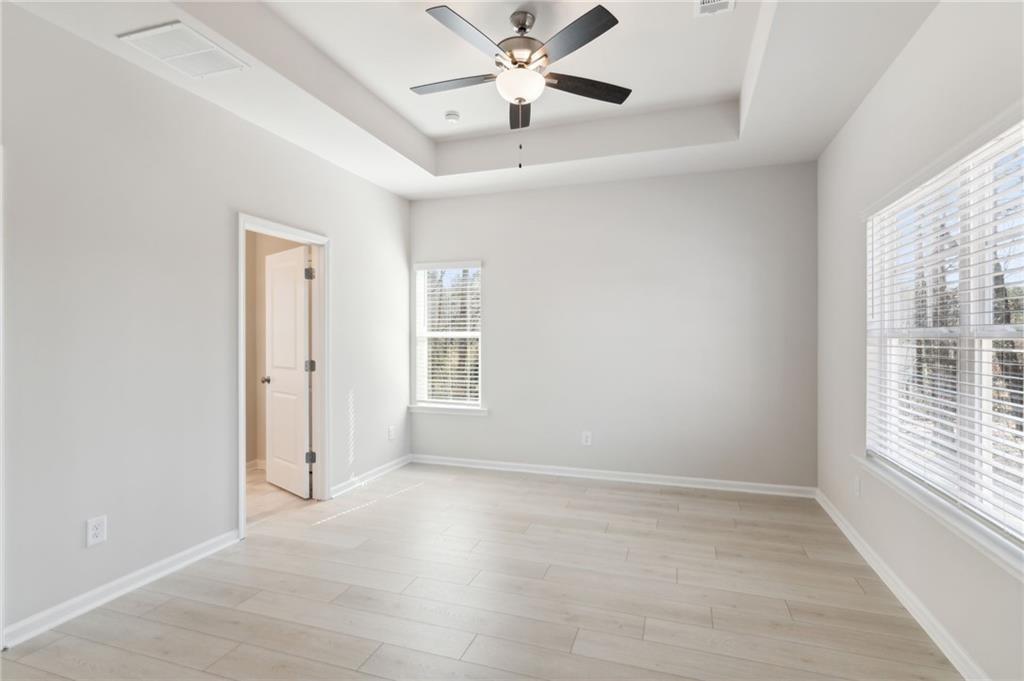 79 Water Oak Way Crawford, GA 30630 - Photo 26 of 51 wooden floor in an empty room with a window