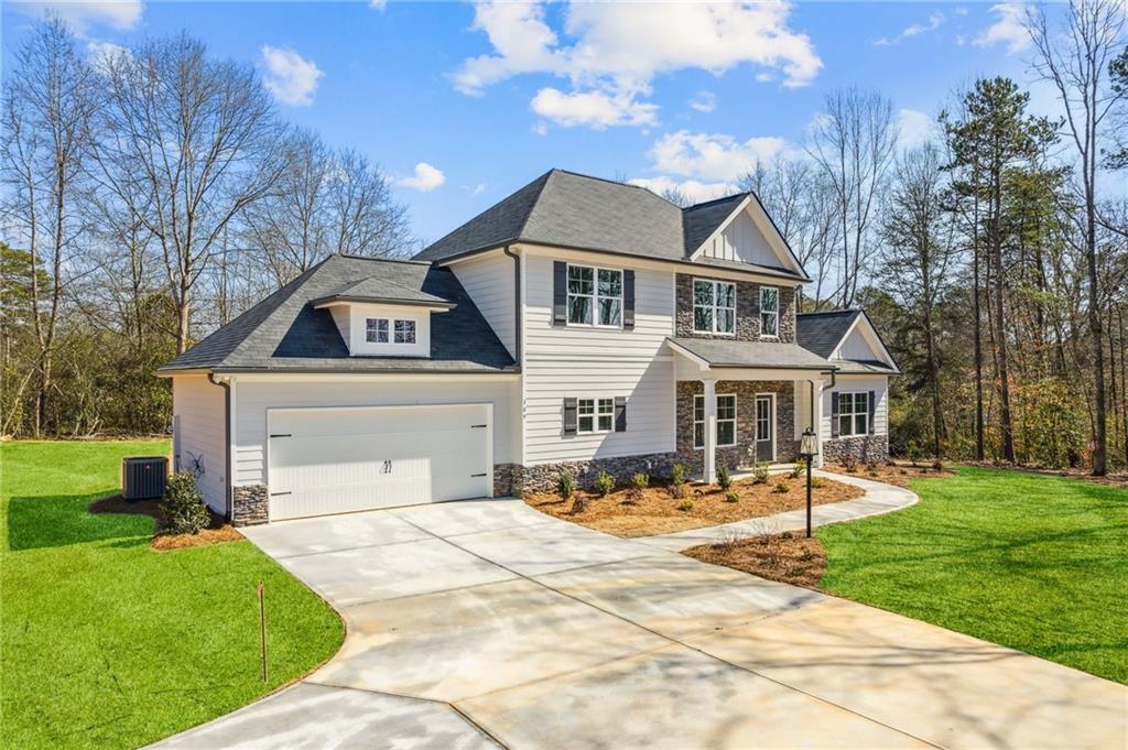 79 Water Oak Way Crawford, GA 30630 - Photo 3 of 51 a front view of a house with a yard