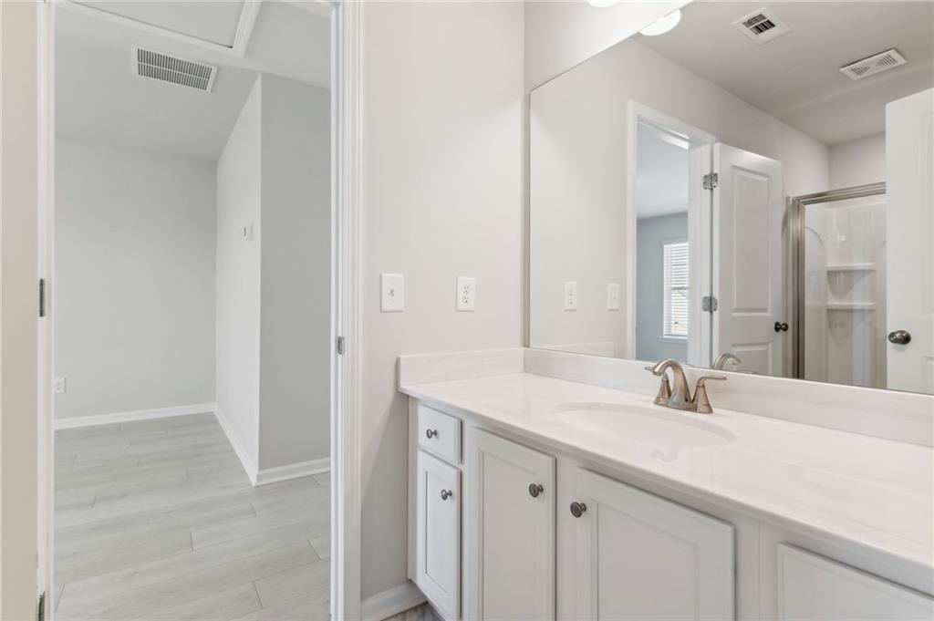79 Water Oak Way Crawford, GA 30630 - Photo 34 of 51 a bathroom with a sink and a mirror