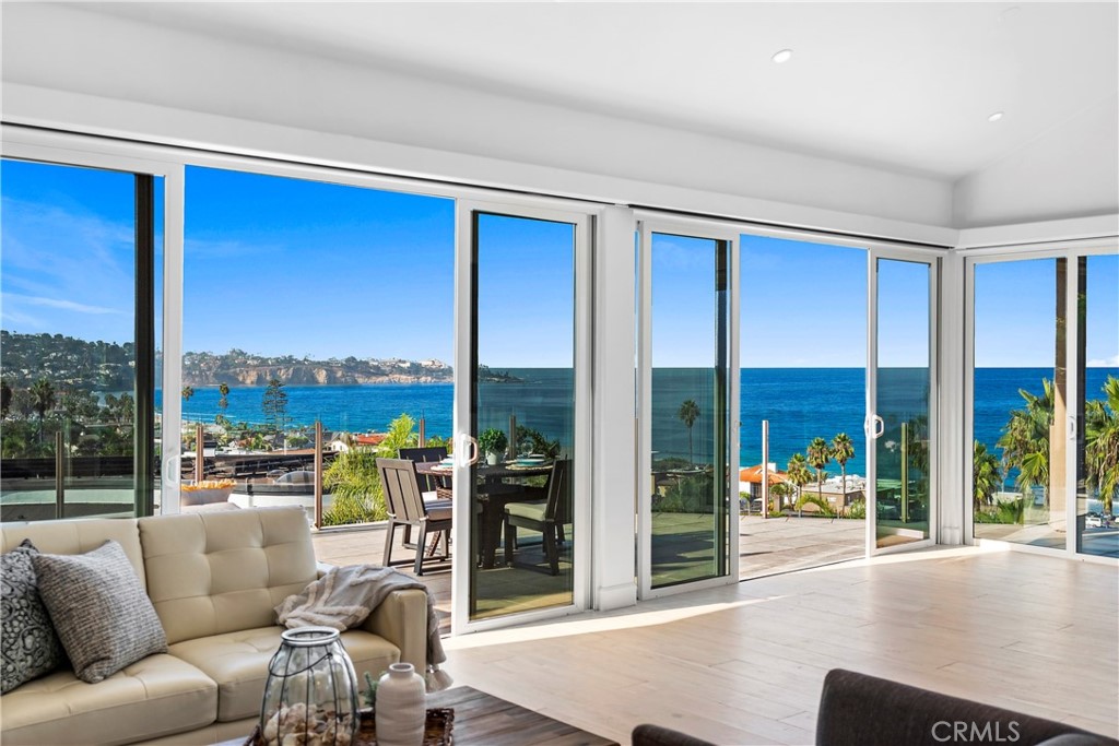 8641 Ruette Monte Carlo La Jolla, CA 92037 - Photo 1 of 74 a living room with furniture and a floor to ceiling window