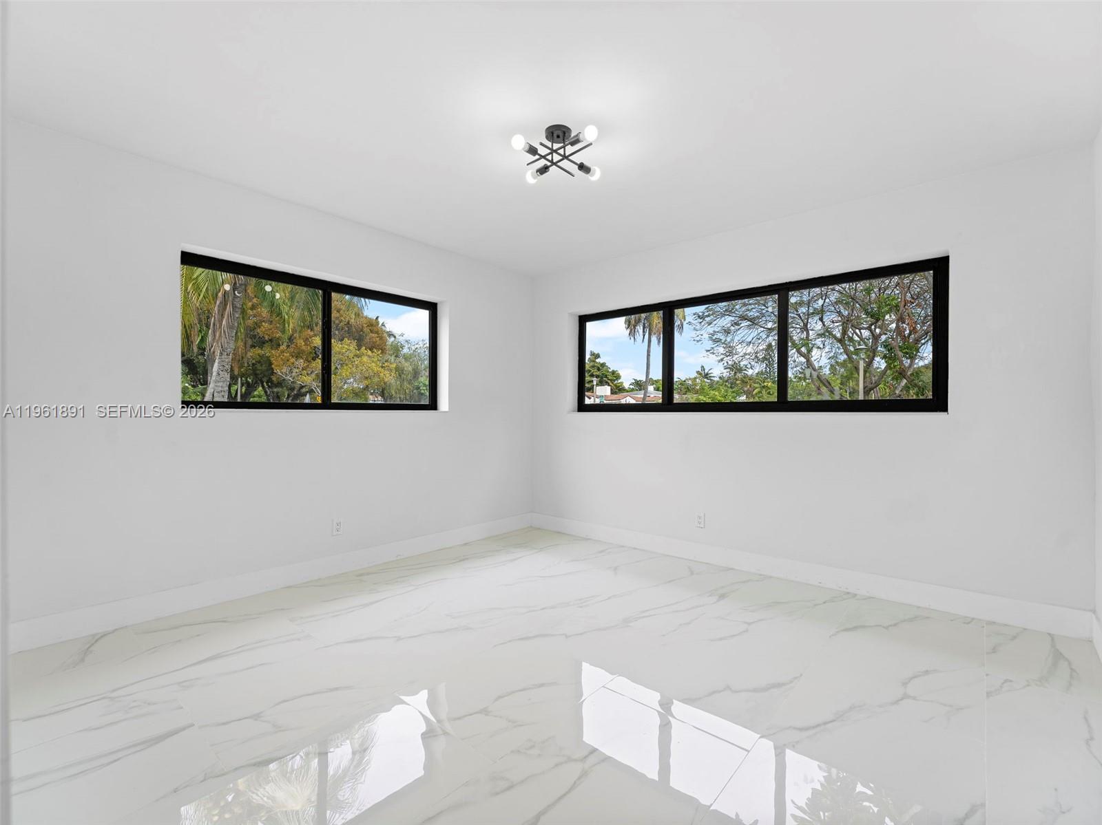 2500 Southwest 23rd Terrace Miami, FL 33145 - Photo 18 of 36 a view of empty room with windows