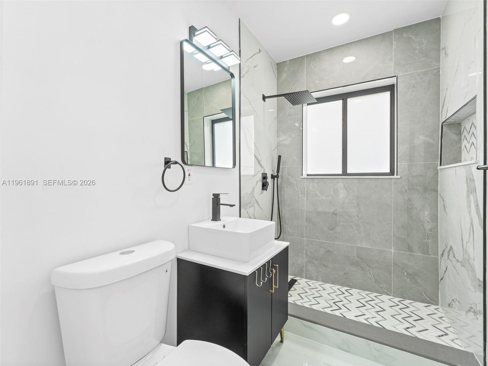 2500 Southwest 23rd Terrace Miami, FL 33145 - Photo 20 of 36 a bathroom with a sink toilet and shower