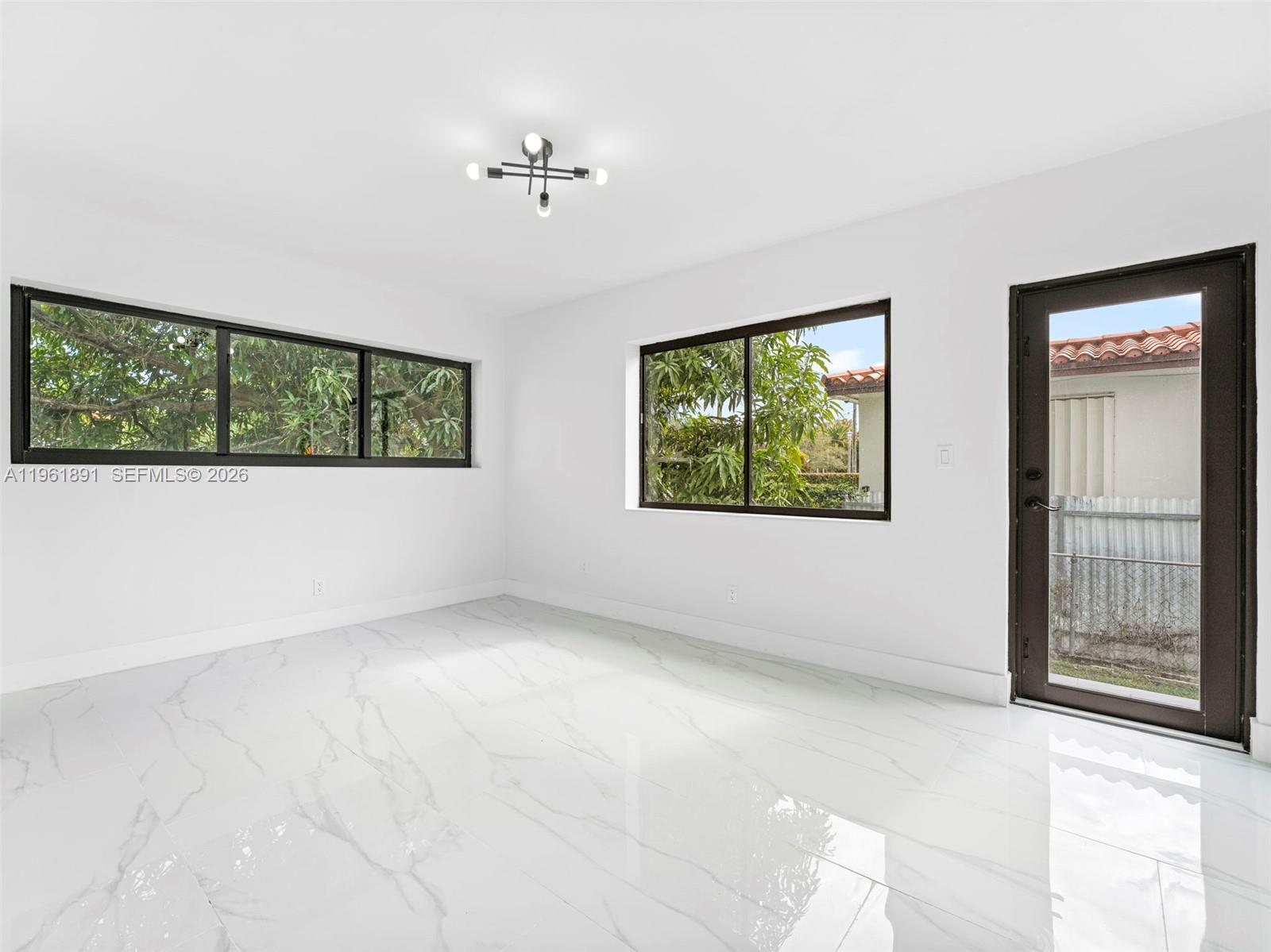 2500 Southwest 23rd Terrace Miami, FL 33145 - Photo 21 of 36 a view of an empty room with windows