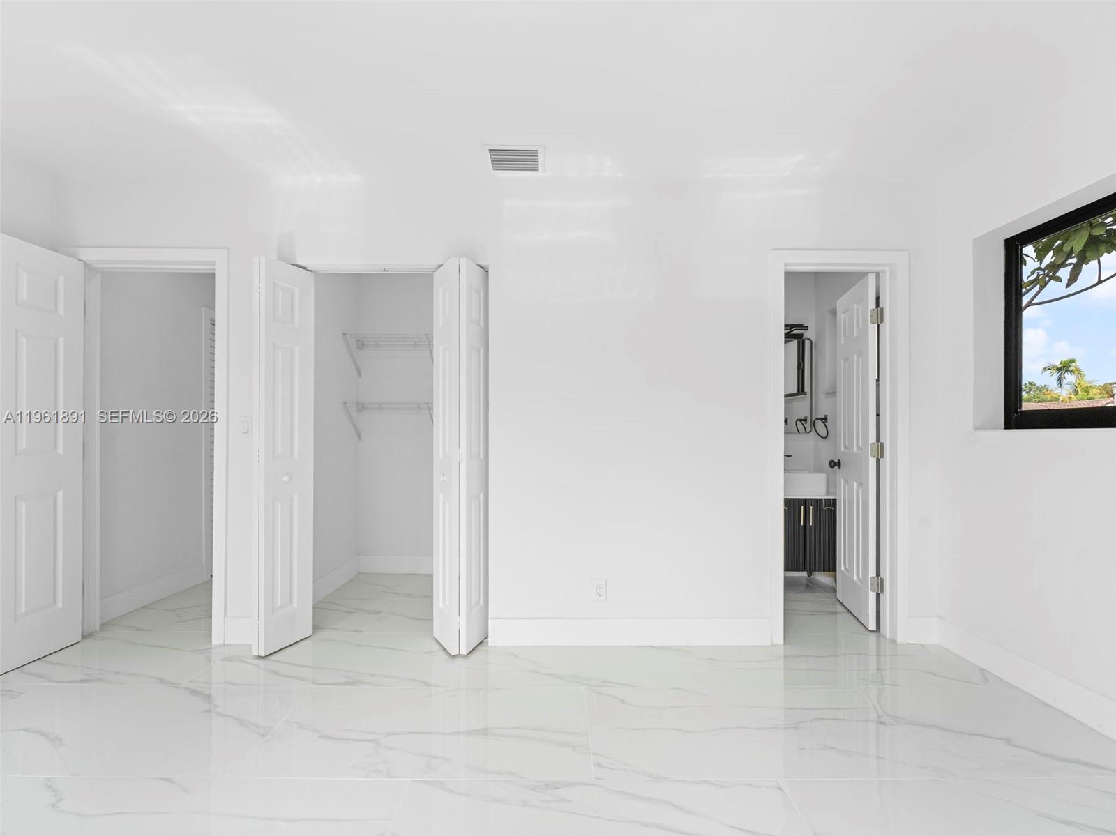 2500 Southwest 23rd Terrace Miami, FL 33145 - Photo 23 of 36 an empty room with windows and closet