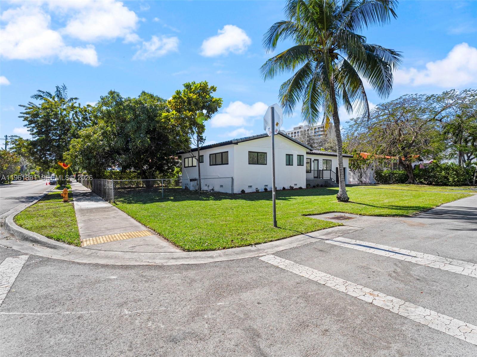 2500 Southwest 23rd Terrace Miami, FL 33145 - Photo 3 of 36 a house with palm tree in front of it