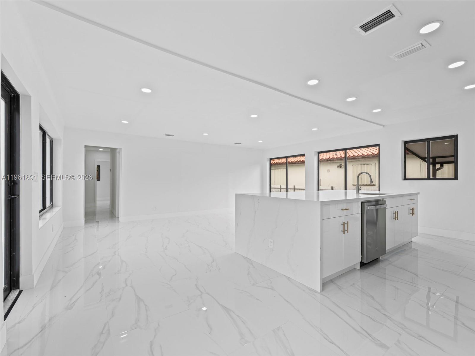 2500 Southwest 23rd Terrace Miami, FL 33145 - Photo 7 of 36 a large white room with lot of stainless steel appliances