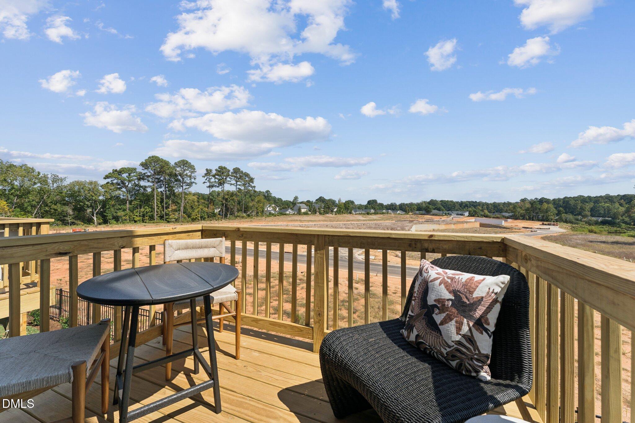 3314 Bomore Road Raleigh, NC 27610 - Photo 2 of 27 a balcony with wooden floor and lake view