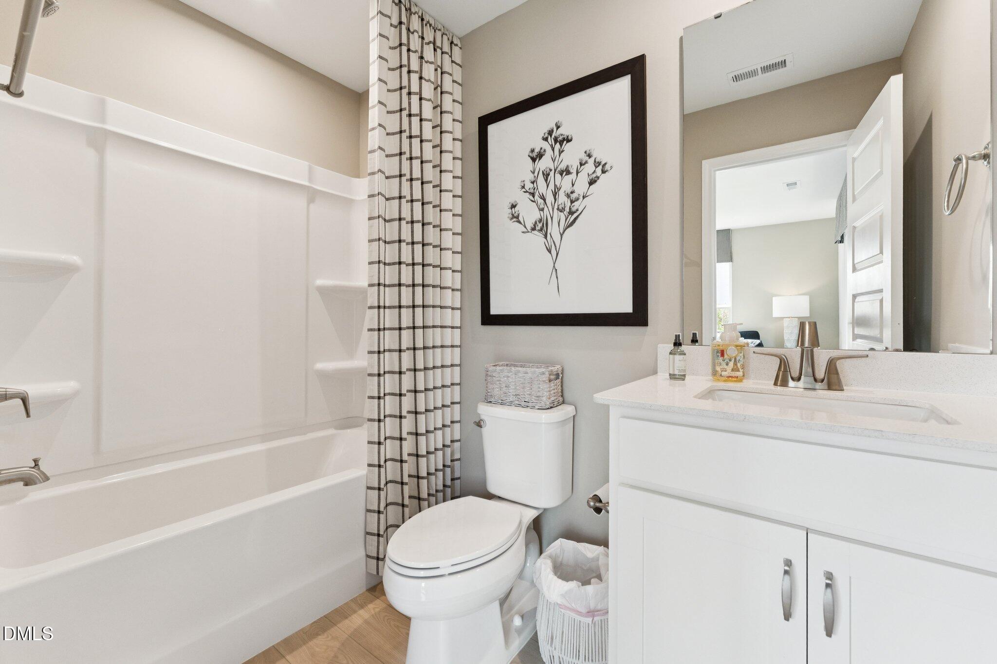 3314 Bomore Road Raleigh, NC 27610 - Photo 9 of 27 a bathroom with a toilet sink and a bathtub