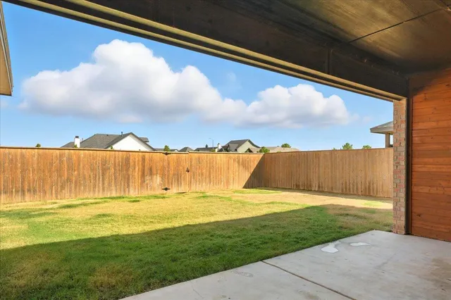 a view of swimming pool with a yard