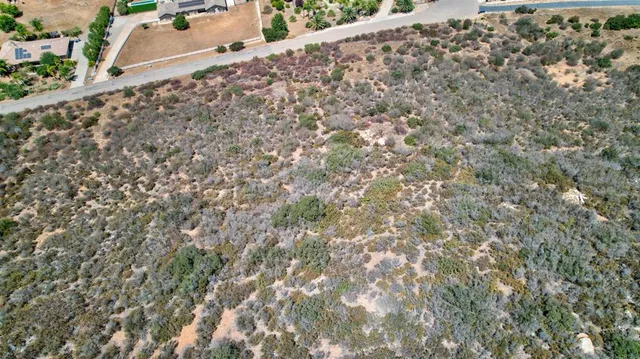 an aerial view of house with yard