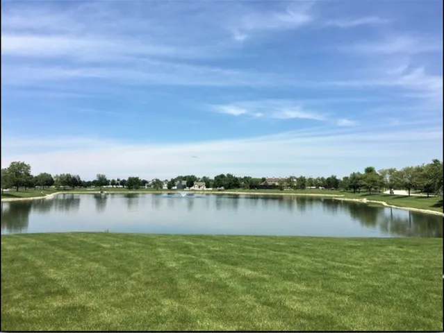 a view of a lake with houses in background