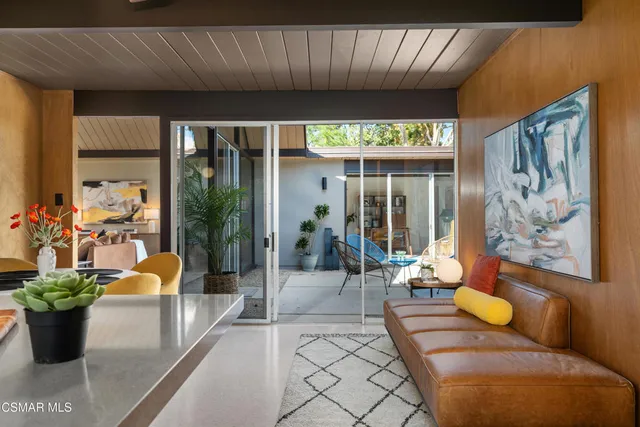 a view of a dining room with furniture window and outside view