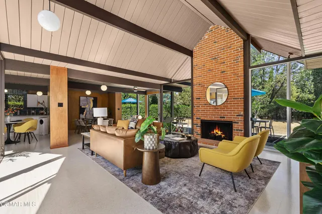 a view of a two chairs in the balcony