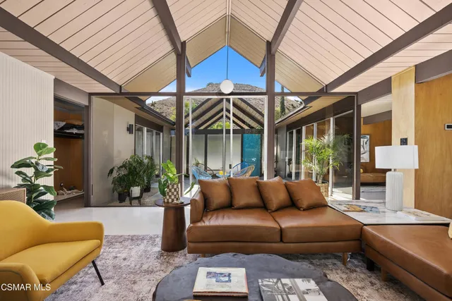 a outdoor living space with furniture and a potted plant