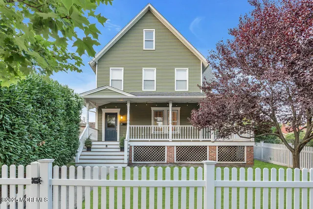 a front view of a house with a porch