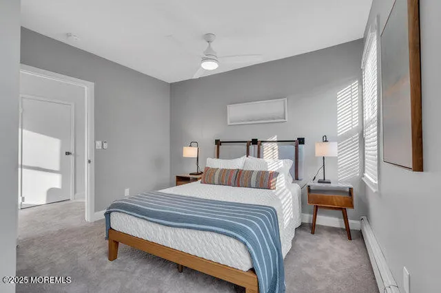 a bedroom with a bed and a lamp