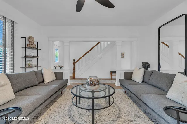a living room with furniture and a rug
