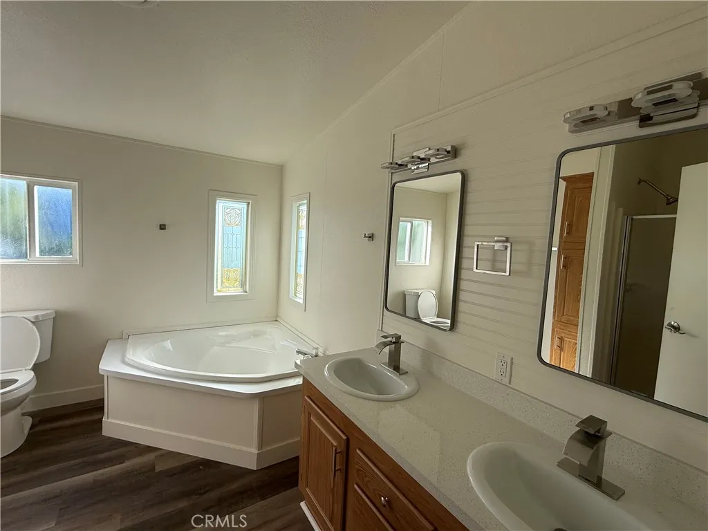 7850 Slater Huntington Beach, Unit 99 Huntington Beach, CA 92647 - Photo 12 of 16 a bathroom with a sink and a mirror