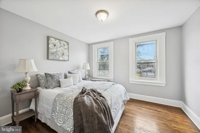 a spacious bedroom with a bed and a window