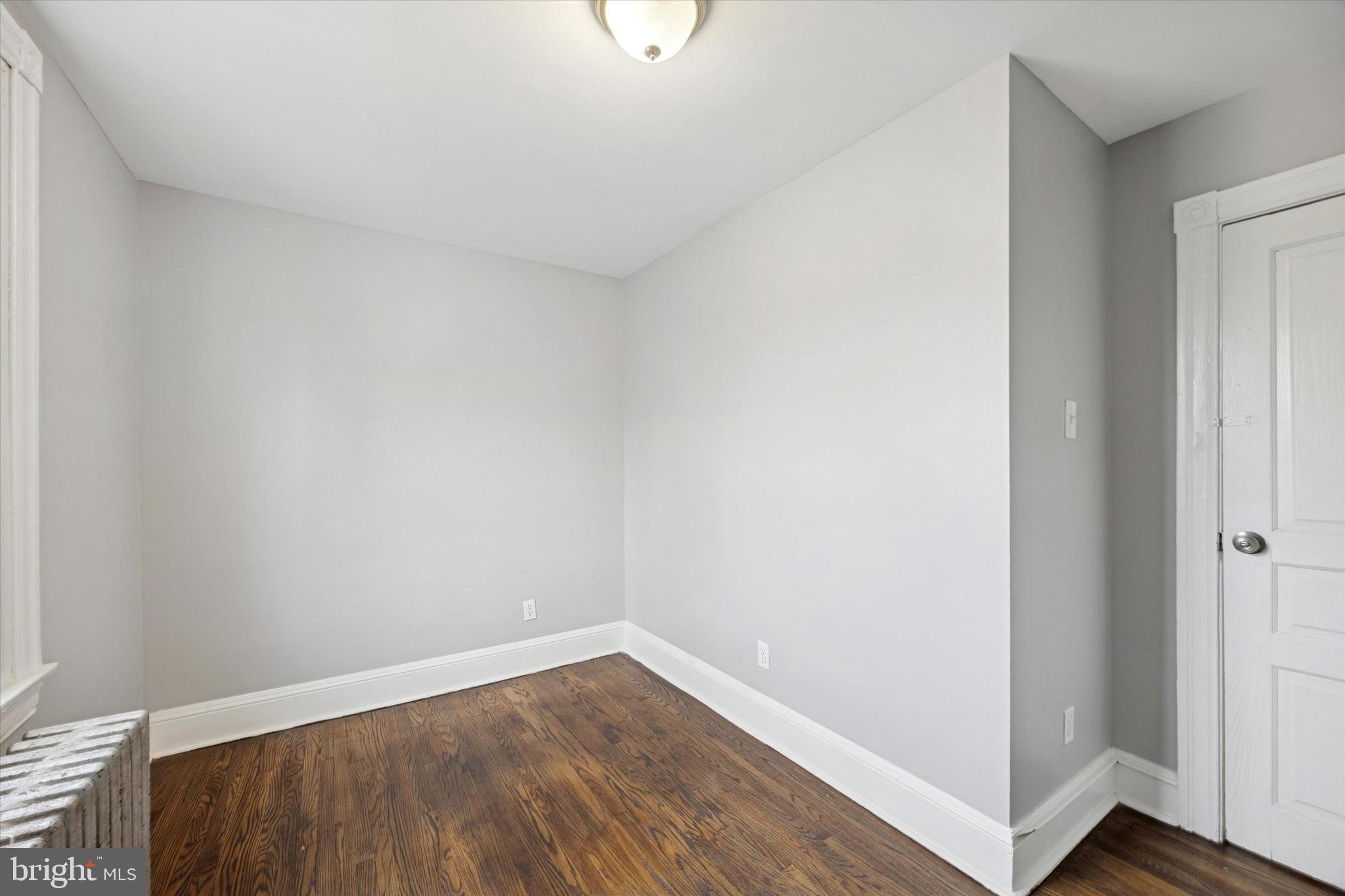 105 Nyack Avenue Lansdowne, PA 19050 - Photo 21 of 29 a view of an empty room with wooden floor and a window