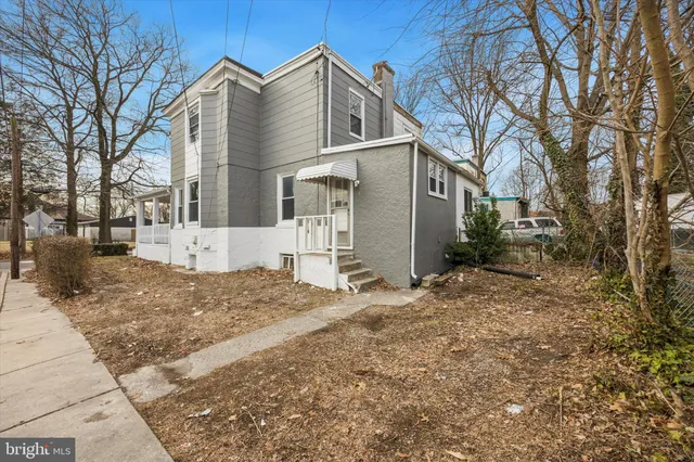 a backyard of a house with large trees