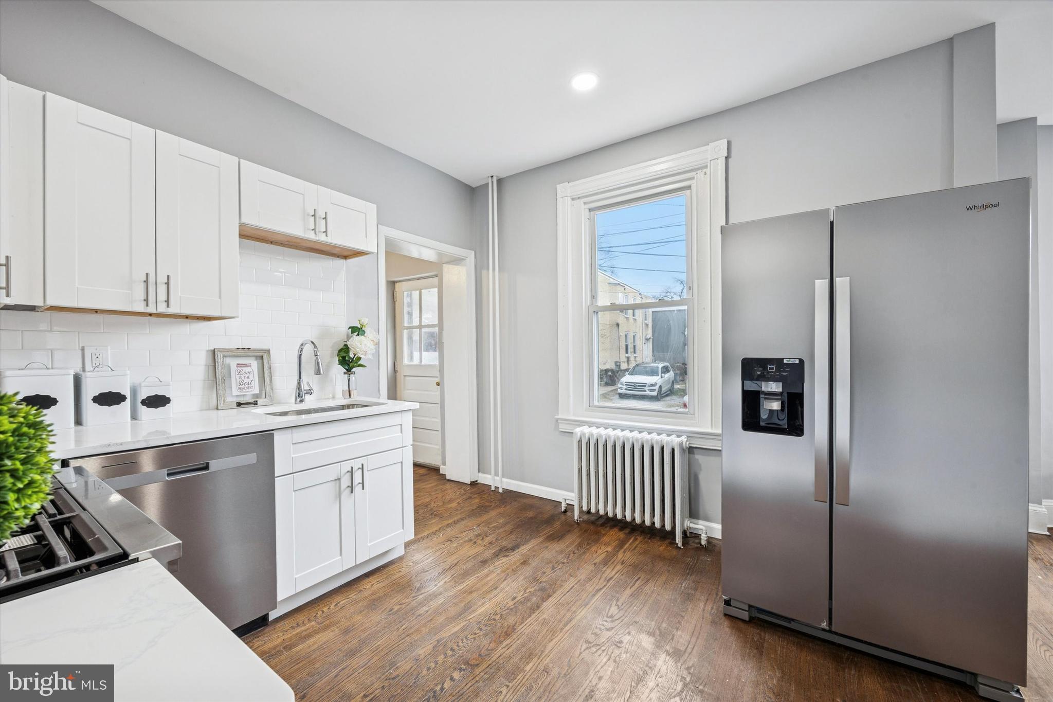 105 Nyack Avenue Lansdowne, PA 19050 - Photo 9 of 29 a kitchen with stainless steel appliances granite countertop a refrigerator sink and cabinets