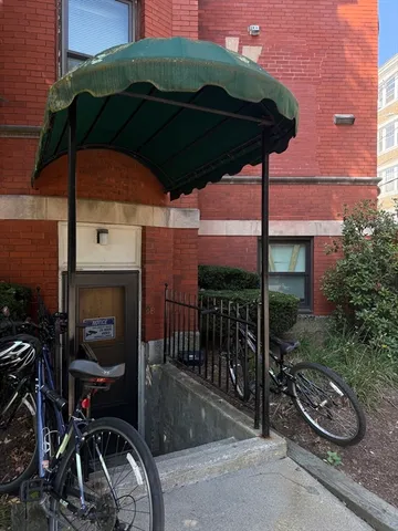 an outdoor space with furniture and umbrella
