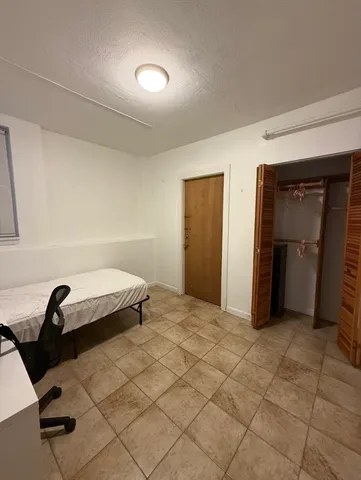 a view of a livingroom with kitchen and furniture