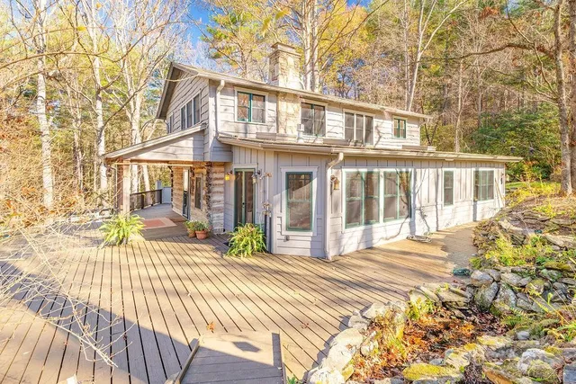 a view of a house with a table and chairs