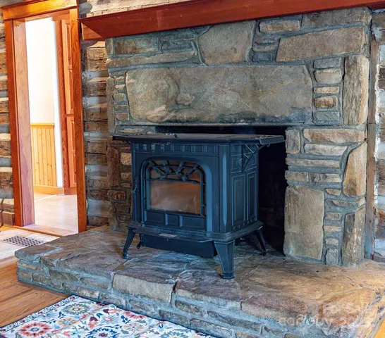 a fireplace with a wooden floor