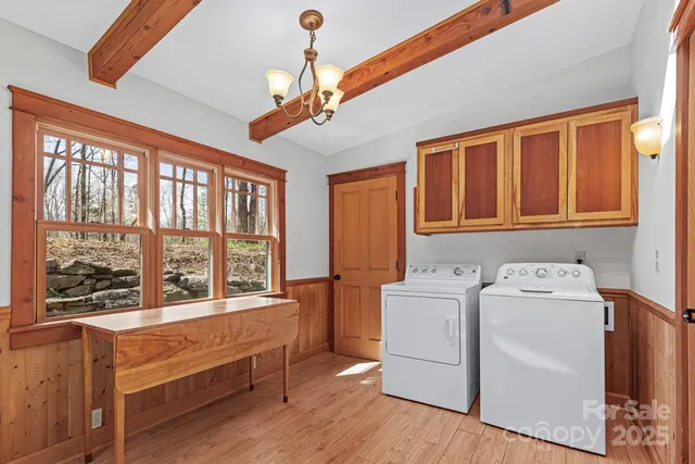 a living room with a large window and washer