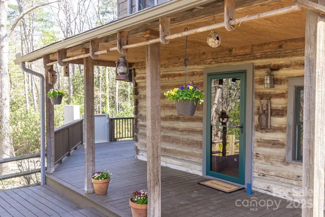 a front view of a house with outdoor seating