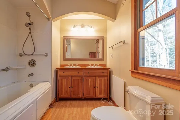 a bathroom with a sink a toilet and bathtub