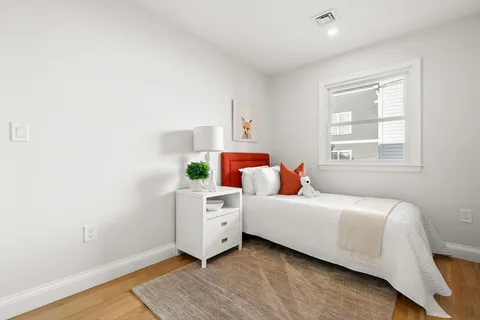 a room with a bed and a window