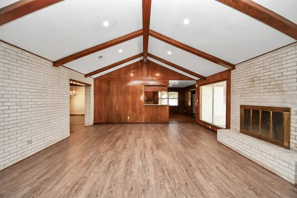 a view of a livingroom with a ceiling fan and window