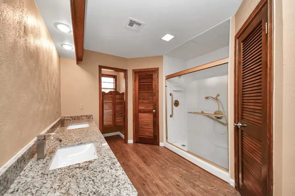 a hallway with sliding door and front door