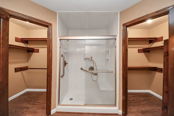 a bathroom with a glass shower door
