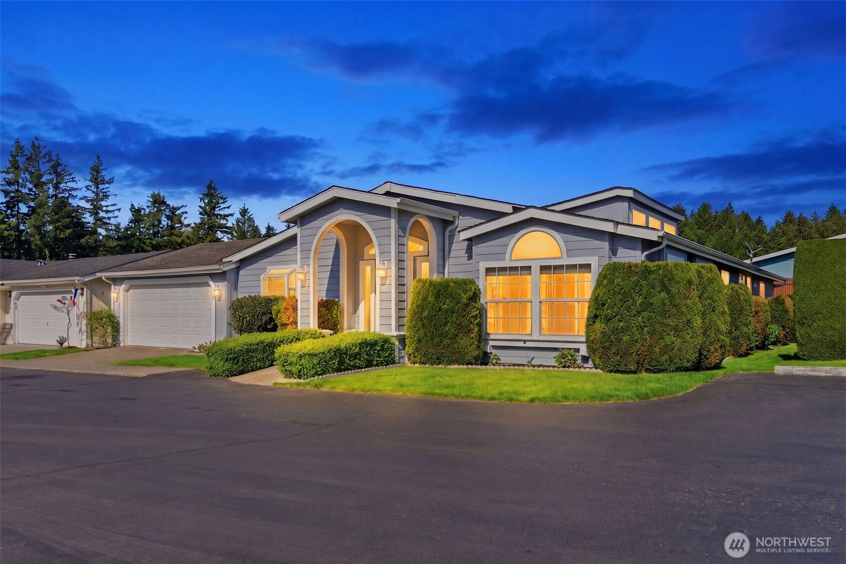 24036 222nd Avenue Southeast Maple Valley, WA 98038 - Photo 1 of 37 a front view of a house with a yard and garage