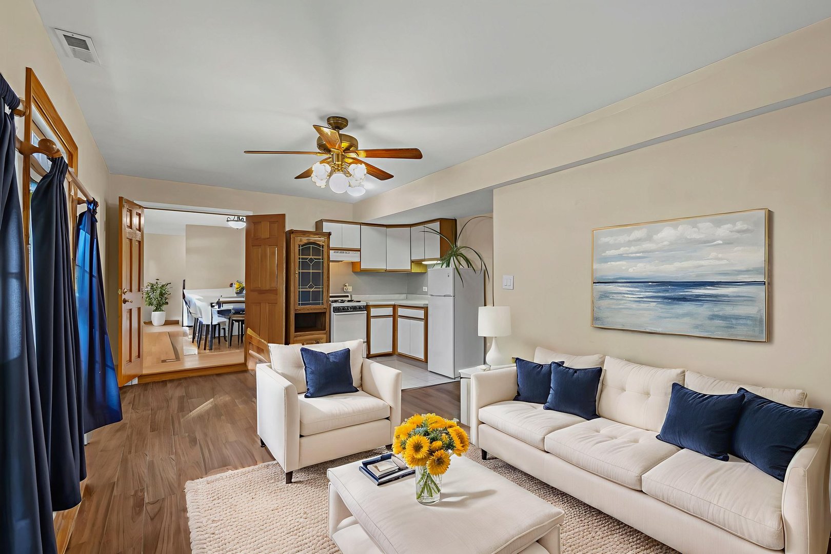 1323 South Roselle Road Schaumburg, IL 60193 - Photo 15 of 51 a living room with furniture a ceiling fan and a window