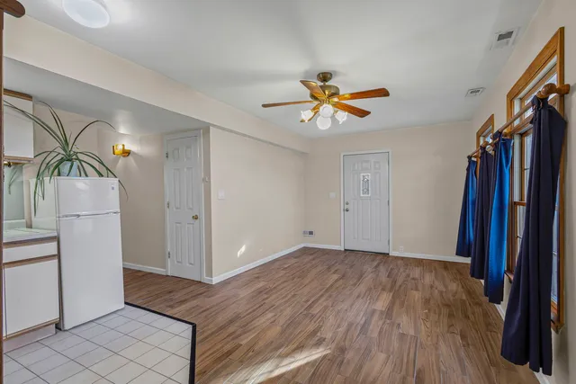 a view of a livingroom with a furniture and wooden floor