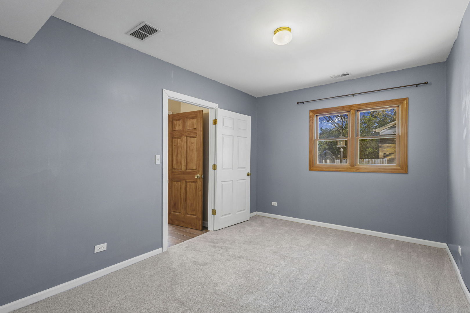 1323 South Roselle Road Schaumburg, IL 60193 - Photo 21 of 51 a view of an empty room with a window