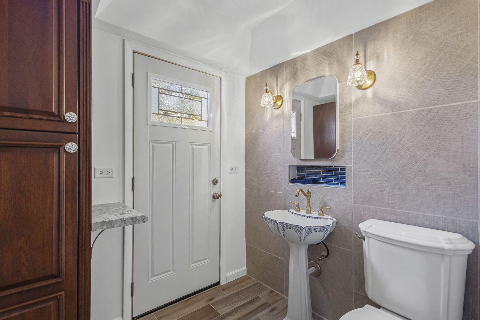 1323 South Roselle Road Schaumburg, IL 60193 - Photo 37 of 51 a bathroom with a sink a toilet and mirror