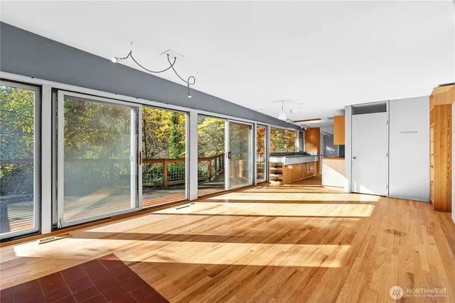 a view of empty room with floor to ceiling windows