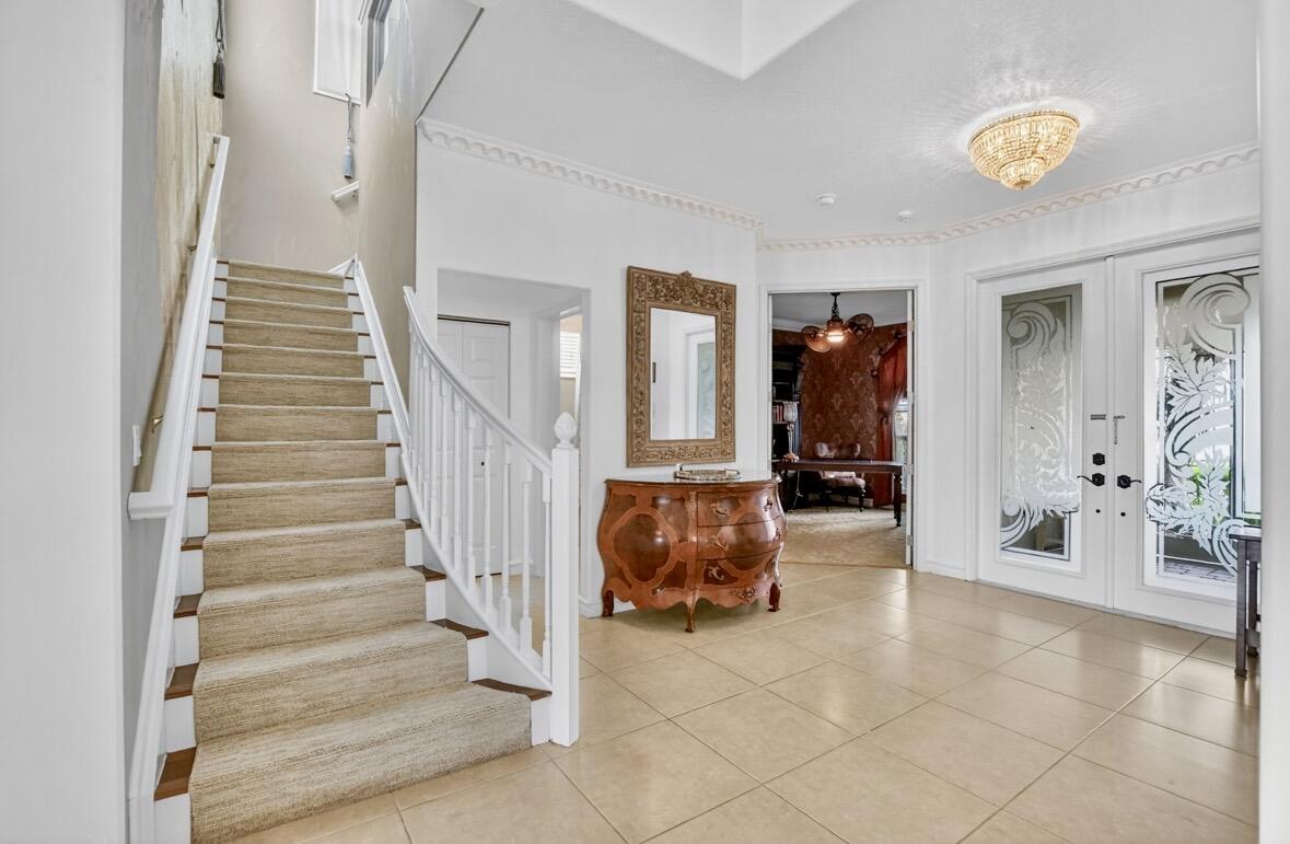 7879 Monarch Court Delray Beach, FL 33446 - Photo 11 of 74 a view of entryway with livingroom and stairs