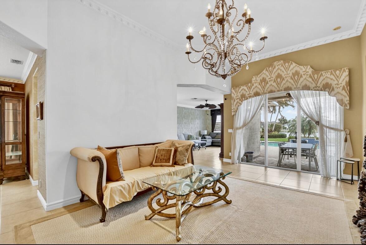 7879 Monarch Court Delray Beach, FL 33446 - Photo 18 of 74 a living room with furniture and a large window
