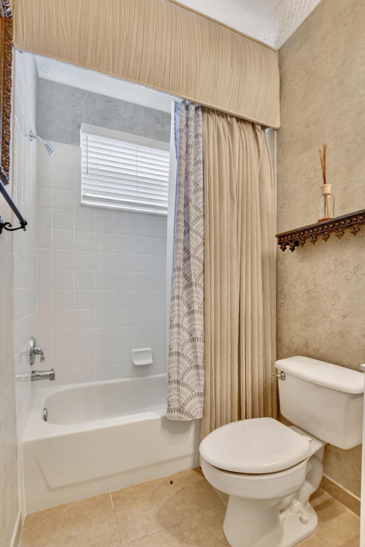 7879 Monarch Court Delray Beach, FL 33446 - Photo 29 of 74 a bathroom with a toilet and a bathtub