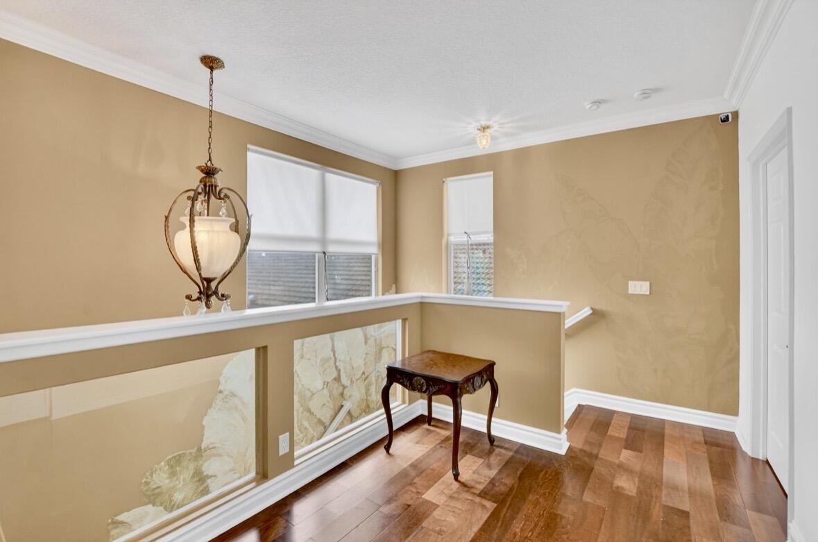 7879 Monarch Court Delray Beach, FL 33446 - Photo 40 of 74 a view of a room with wooden floor and window